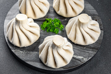 khinkali meat filling frozen product semi finished Georgian cuisine food meal food snack on the table copy space food background rustic top view