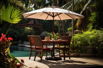 Cafe table with chair and parasol umbrella in the garden
