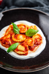 ravioli seafood tomato sauce italian food second course meal food snack on the table copy space food background rustic top view