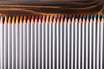 Group of many different types of pencils on an abstract background
