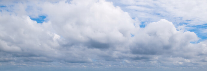 Blue sky and white clouds. Wide photo.
