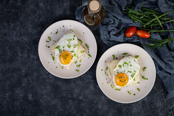 Croque madame with bechamel sauce. Freanch toasts with ham, cheese and fried egg