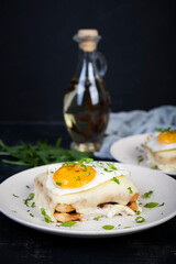 Croque madame with bechamel sauce. Freanch toasts with ham, cheese and fried egg