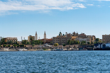 Luxor, Egypt: Nile river landscape view with church and mosque
