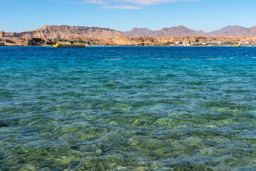 Sharm El-Sheikh, Egypt: beach with blue water sea mountain view.
