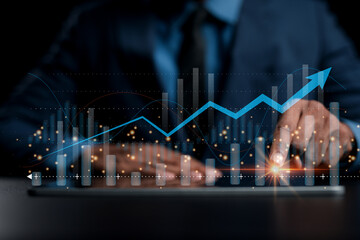 Business people analyzing data graphs and charts displayed on the digital tablet screen. Business analytics and financial technology. Technology stocks and future investments.