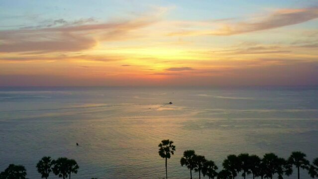 .aerial view scenery colorful sunset above Promthep cape..stunning cloud in the beautiful sky above suger parm trees..Imagine a fantasy clouds changing in colorful sky..Dramatic Sky background.