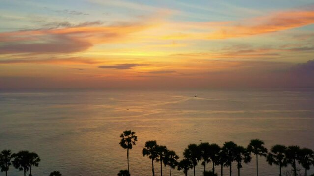 .aerial view scenery colorful sunset above Promthep cape..stunning cloud in the beautiful sky above suger parm trees..Imagine a fantasy clouds changing in colorful sky..Dramatic Sky background.