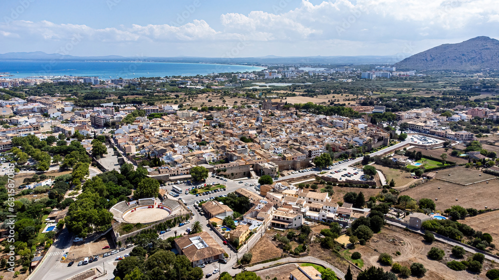 Wall mural aerial view of the medieval walled city of alcudia on the balearic island of majorca (spain) in the 