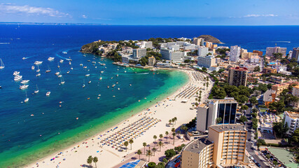 Fototapeta premium Aerial view of the beach of Son Matias in Magaluf, a seaside resort town on Majorca in the Balearic Islands, Spain