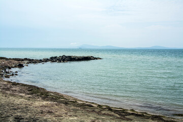 Fototapeta na wymiar The calm sea near Sarafovo and the famous black sand common in the region of Burgas