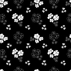 Seamless modern pattern of  white silhouettes of abstract flowers and dots on black background. Trendy abstract art template for printing onto fabric, wrapping paper, cover, postcards, background.