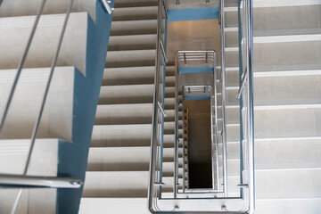 Stairwell in a modern building. Staircases as an emergency evacuation exit from the building in...
