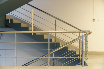 Stairwell in a modern building. An empty spacious hall with a flight of stairs in the business...