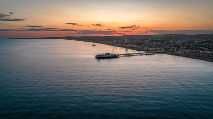 Aerial view of a seaside, Brighton Pier and beach, Brighton, East Sussex, UK