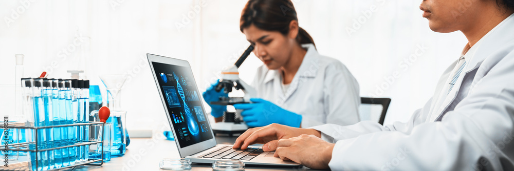 Wall mural group of dedicated scientist conduct chemical experiments and research in medical lab as groundbreak