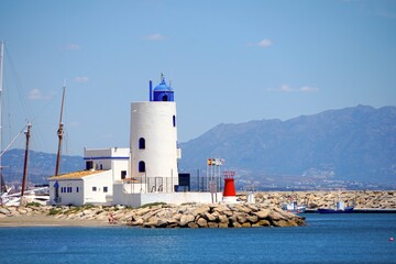 Fototapeta na wymiar lighthouse at the famous marina La Duquesa, Duquesa Port, Manilva, Andalusia, Estepona, Marbella, Malaga, Spain