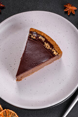 Delicious, fresh, sweet chocolate cake with nuts cut into slices