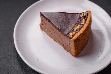 Delicious, fresh, sweet chocolate cake with nuts cut into slices