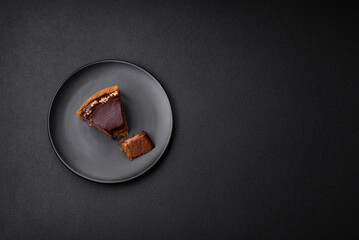 Delicious, fresh, sweet chocolate cake with nuts cut into slices