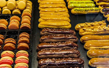 many of  colorful cakes are on display