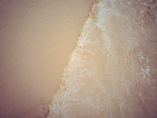 Top down view of current change in Sava river during flooding with clear visible line separating two currents due to change of the flow strength