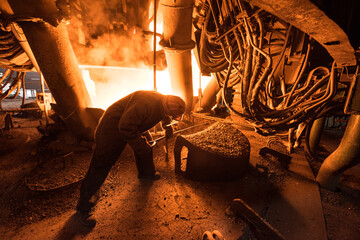 Steelworker at work near the arc furnace - 631627481