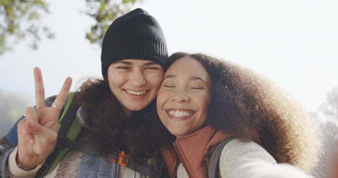 Selfie, peace sign and friends in nature for adventure, travel and hiking. Face of happy women together for profile picture, freedom or social media memory on holiday or journey with freedom outdoor