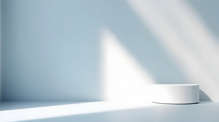 Minimal abstract light blue background for product presentation. Shadow and light from windows on plaster wall.