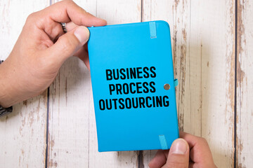 There is notebook with the word Business Process Outsourcing. It is as an eye-catching image