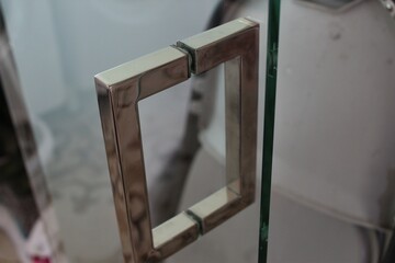 Close up of a glass door handle