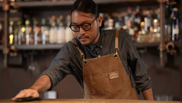 Night club concept of 4k Resolution. Asian staff cleaning the restaurant before getting ready to open. A group of specialized clubs that sell alcoholic beverages.