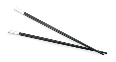 Pair of black chopsticks isolated on white, top view