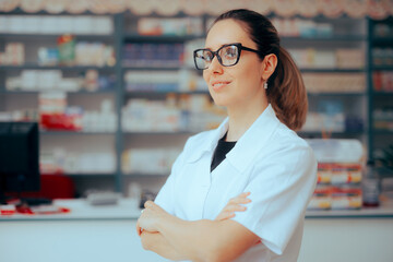 Happy Pharmacist Standing with her Arms Crossed. Professional health care worker standing in a...