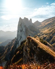 Tiny person in front of the Huge mountains in the Appenzeller region, Saxer Lücke, during a...