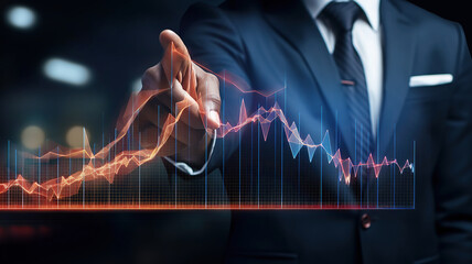 businessman is indicating the corporate future growth plan on an arrow graph