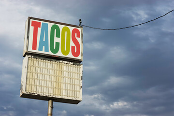 Old run-down vintage tacos sign