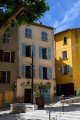 Travel destination, small ancient village Cotignac in Var, Provence, surrounded by vineyards and cliffs with troglodytes houses.