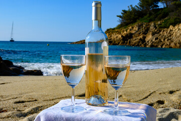 Summer time in Provence, two glasses of cold rose wine on Pampelonne sandy beach near Saint-Tropez...