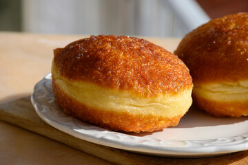 Fried in oil french stuffed with apples or chocolate beignets donuts pastry, sweet dessert served outdoor