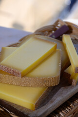 French cheese Comte, three varieties 1 year matured Prestige, fruity flavoured Fruite and Vieille Reserve close up