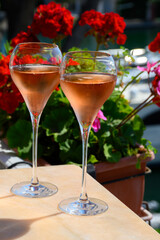 Summer party, drinking of French brut rose champagne sparkling wine in glasses in yacht harbour of Port Grimaud near Saint-Tropez, French Riviera vacation, France