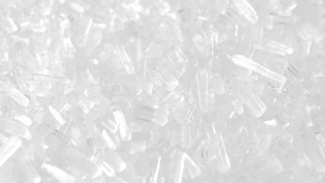 Macro video of MSG showcases its microscopic crystals, revealing the flavor-enhancing magic. As it dissolves, the umami essence bursts, captivating taste buds worldwide. 
