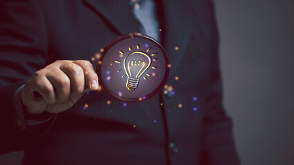 business idea concept. businessman using magnifying glass to search for ideas in work. brainstorming in corporate work with every filed like engineering, industry, education, online data.