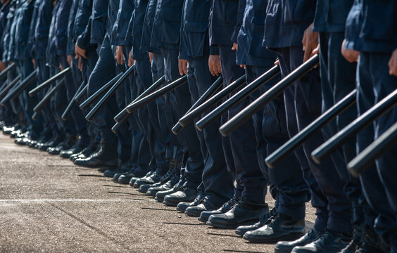 Riot police control the crowd..
