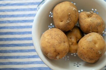 bowl of potatoes on a table cloth