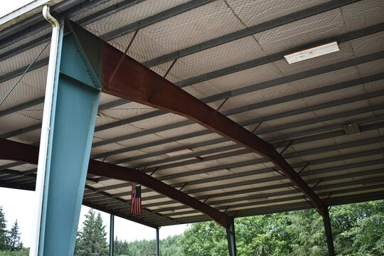 American flag hangs in large pole barn.