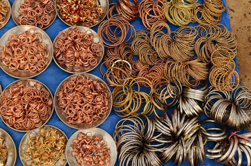 Fototapeta premium These rings and bracelets made of different metals are arranged for sale