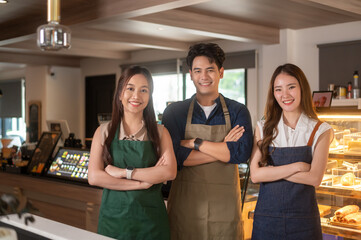 Portrait Group of  Asian cafe owners entrepreneurs smiling in coffee shop, small business concept