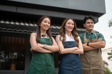 Portrait Group of  Asian cafe owners entrepreneurs smiling in coffee shop, small business concept